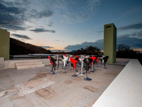 a group of chairs and a table on a roof at Bophirima Boutique Hotel in Rustenburg