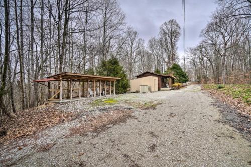 a dirt road with a building on the side at Cozy Tennessee Cabin Rental - 1 Mi to Lake in Frogue