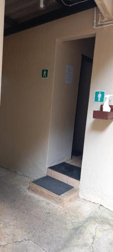 a hallway of a building with two floors and a door at Fairhills Self Catering Caravan Units in Margate