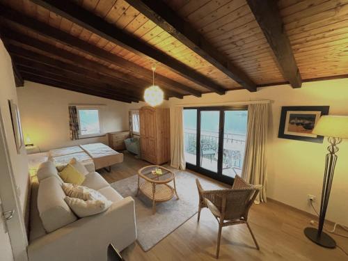 a living room with a couch and a table at Residenza Bettina BnB & Ferienwohnungen in Ronco s/Ascona - Porto Ronco