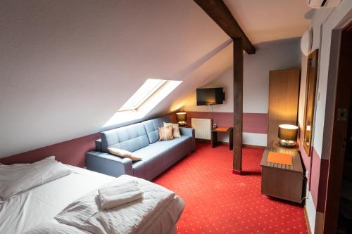 Postel nebo postele na pokoji v ubytování Hotel Podkowa