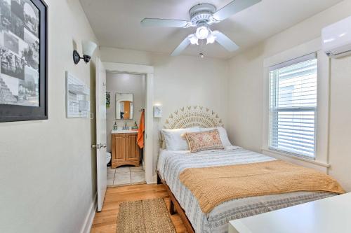 a bedroom with a bed and a ceiling fan at Colorful Long Beach Bungalow with Patio and Grill in Long Beach