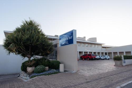 a hotel with a sign in a parking lot at Saldanha Bay Hotel in Saldanha