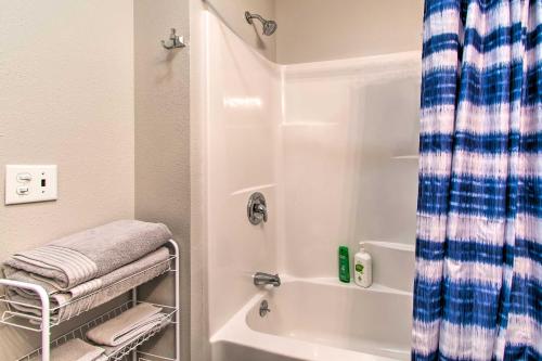 een badkamer met een douche en een handdoekenrek bij Peaceful Missouri Cabin Rental on 55 Acres! in Canton