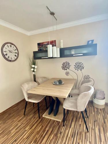 a dining room with a wooden table and chairs at Apartment on Gellért Hill Budapest Downtown with free garage & Castle View in Budapest