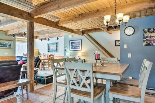 a dining room and living room with a table and chairs at Cozy Conway Area Home about 4 Mi to Cranmore Mountain! in Intervale