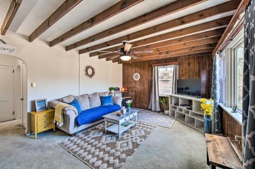 a living room with a blue couch and a tv at Pet-Friendly Mohnton House Near Golf Course! in Mohnton