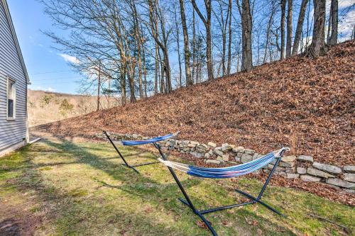 two hammocks in a yard next to a stone wall at Pet-Friendly Mohnton House Near Golf Course! in Mohnton