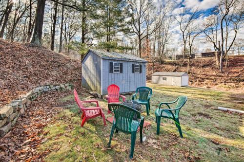 a group of chairs in front of a tiny house at Pet-Friendly Mohnton House Near Golf Course! in Mohnton