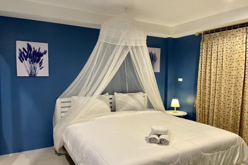 Postel nebo postele na pokoji v ubytování Be Rich Hotel
