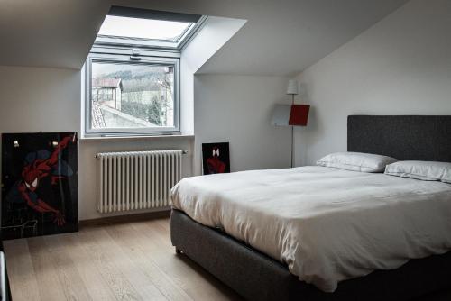 a bedroom with a large bed and a window at A casa di Rocco in Castel di Sangro