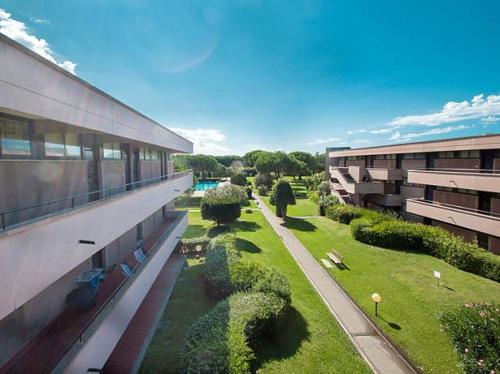 an overhead view of a building with a grass yard at Premium Apartment Bilo H2 in Marina di Bibbona