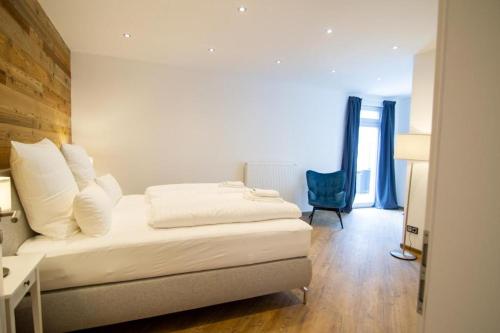Katil atau katil-katil dalam bilik di Schiefer Suite Hotel & Apartments