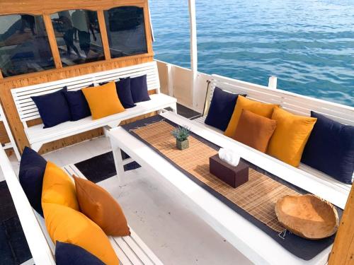 a boat with couches and pillows on the water at Komodo liveabord 3 Days 2 Night Depart every Friday-Sunday in Labuan Bajo