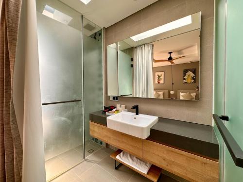 a bathroom with a sink and a mirror at West Phu Quoc Charm 3BR private pool villa in Phu Quoc