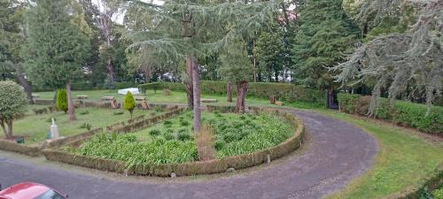 a garden with a circular path in a park at Casa Diocesana VIA LUCIS in Santiago de Compostela