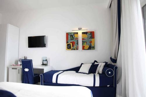Ein Bett oder Betten in einem Zimmer der Unterkunft Hotel Bristol