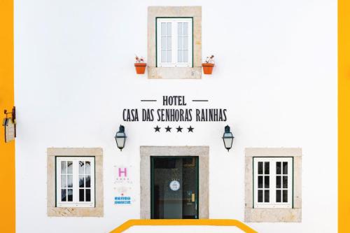 a collage of photos of the front of a white building at Casa Senhoras Rainhas - Óbidos - by Unlock Hotels in Óbidos