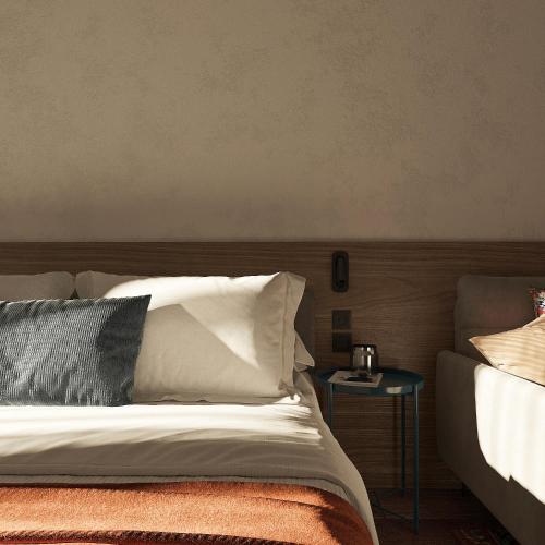 a bedroom with a bed and a side table at Blueloft 47 l studio with balcony Tashkent City Center in Tashkent