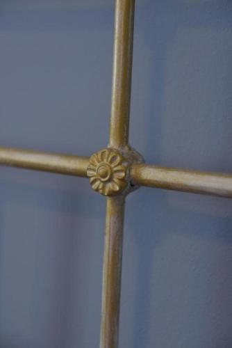 a close up of a metal pole with a ceiling at Oisyra Boutique Suites in Ermoupoli