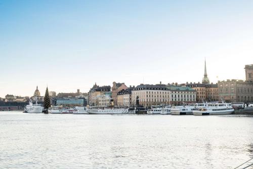 a view of a city with boats in the water at Hôtel Reisen in The Unbound Collection by Hyatt in Stockholm