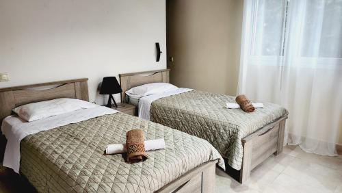 En eller flere senge i et værelse på CORFU ALINA'S APARTMENTS