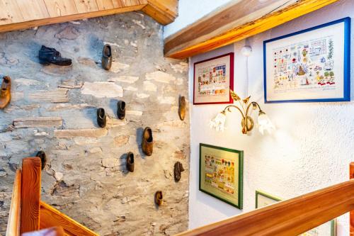 a stone wall with some items on it at Arpy an in Morgex