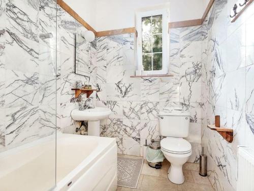 a bathroom with a toilet and a sink and a tub at Babil Bahceleri - Gardens of Babel in Lapithos