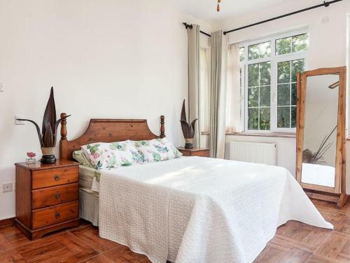 a bedroom with a bed and a dresser and a mirror at Babil Bahceleri - Gardens of Babel in Lapithos