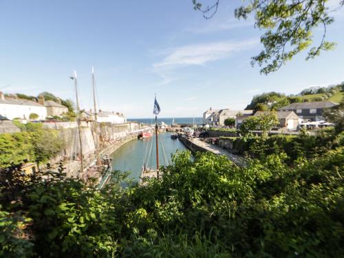 a body of water with a boat in it at Hillcroft in St Austell