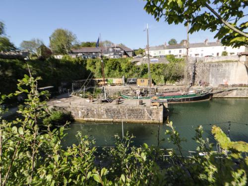 a couple of boats docked in a harbor at Hillcroft in St Austell