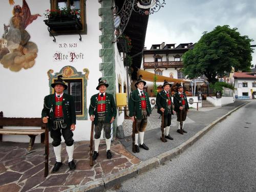 a group of figurines of soldiers standing on a street at Gasthof & Hotel Zur Post in Wallgau