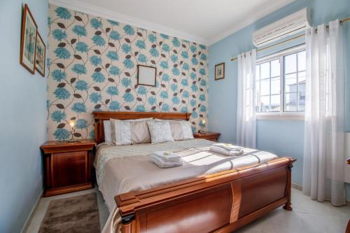 Postel nebo postele na pokoji v ubytování Villa Teixeira