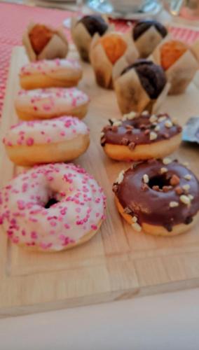 a bunch of donuts sitting on a cutting board at Alpina Boutique Hotel Interlaken - Ringgenberg - Adults only ! in Ringgenberg