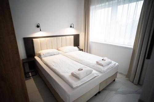 Ένα ή περισσότερα κρεβάτια σε δωμάτιο στο Apartament Powidz