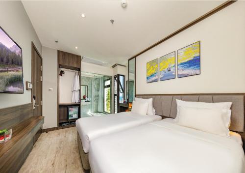Katil atau katil-katil dalam bilik di Ivy Hotel Nha Trang