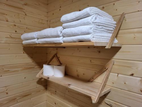 a towel rack in a sauna with towels at Casa do Quinteiro in Arcos de Valdevez