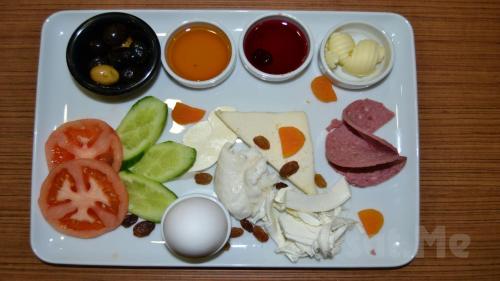 a plate of food with vegetables and other ingredients at ŞİRİNYER APART OTEL in Izmir