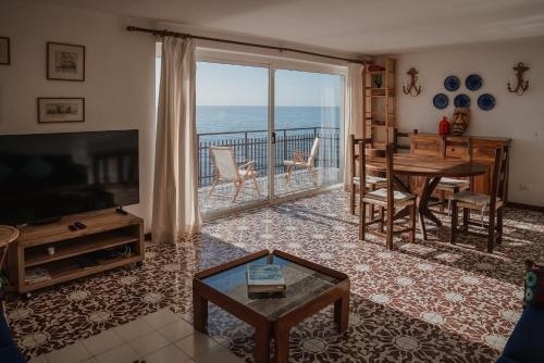 a living room with a view of the ocean at Be Your Home - Appartamento 4 camere sul Mare scesa al mare privata in Santa Marinella