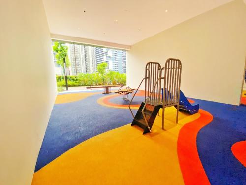 a childrens play room with a playground at Amazing KLCC SKY view infinity pool Eaton Residences Suites in Kuala Lumpur