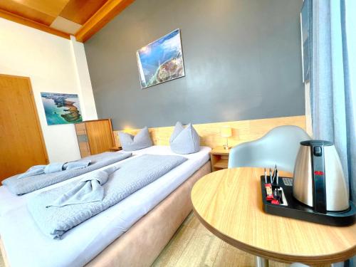 Katil atau katil-katil dalam bilik di BnB Fliegerhaeusle Hagnau 24h Self Check In