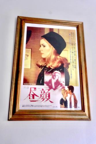 a framed picture of a woman in a hat at Belle de Nuit in Ostend