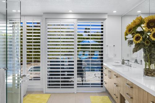a kitchen with a large window with blinds at Sundance Condo Permit# 2370 in Palm Springs