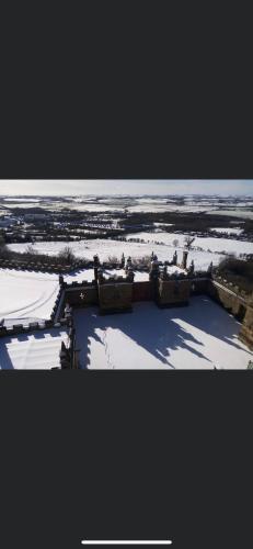 an aerial view of a building in the snow at Bolsover Castle View in Bolsover