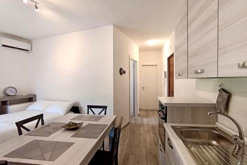 a kitchen with a sink and a counter top at Casa Olympia in Peschiera del Garda
