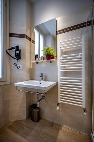 a bathroom with a sink and a mirror at Residenza Giotto in Florence