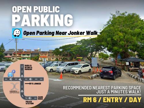 an open public parking sign in a parking lot at Heeren Inn Melaka in Malacca