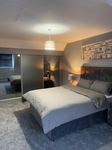 a bedroom with a large bed in a room at Boothferry Park Lodge in Hull