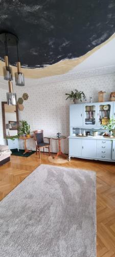 a living room with a table and a rug at Alterra Apartment,13 legionowa street, flat, mieszkanie 41 in Białystok