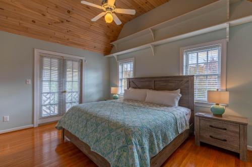 a bedroom with a bed and a ceiling fan at Mountain Gem in Boone